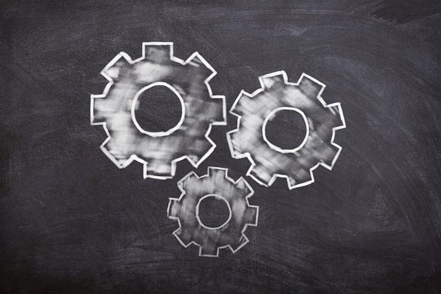 Chalk illustration of gears on a blackboard